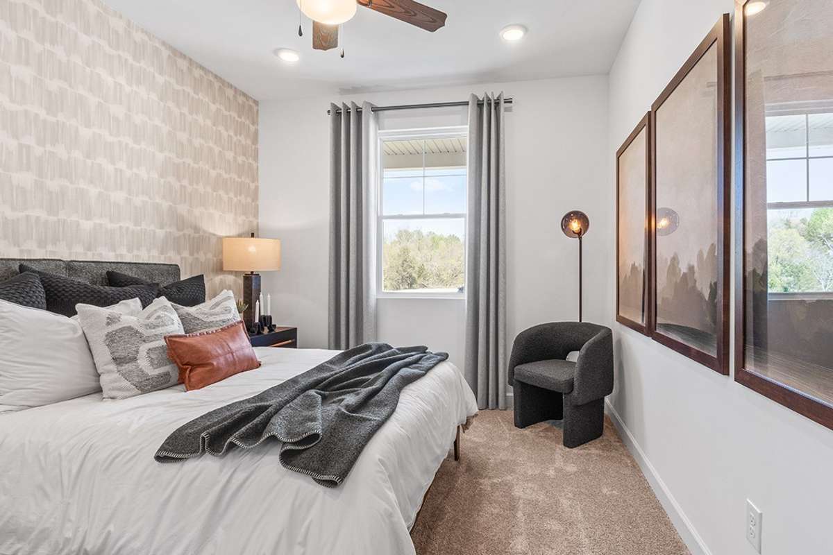 This is a photo of one of our model homes. Please know that some of the exterior and interior finishes, paint, and features may vary.