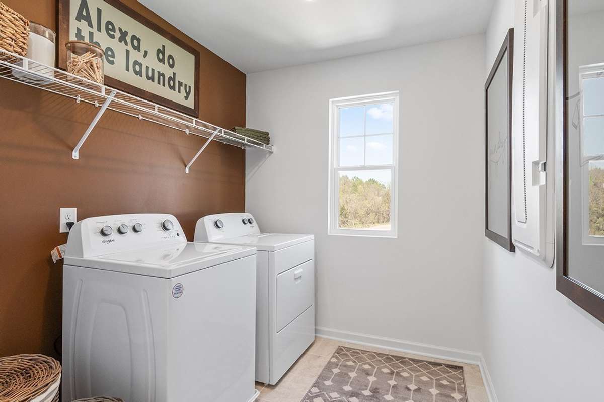 This is a photo of one of our model homes. Please know that some of the exterior and interior finishes, paint, and features may vary.
