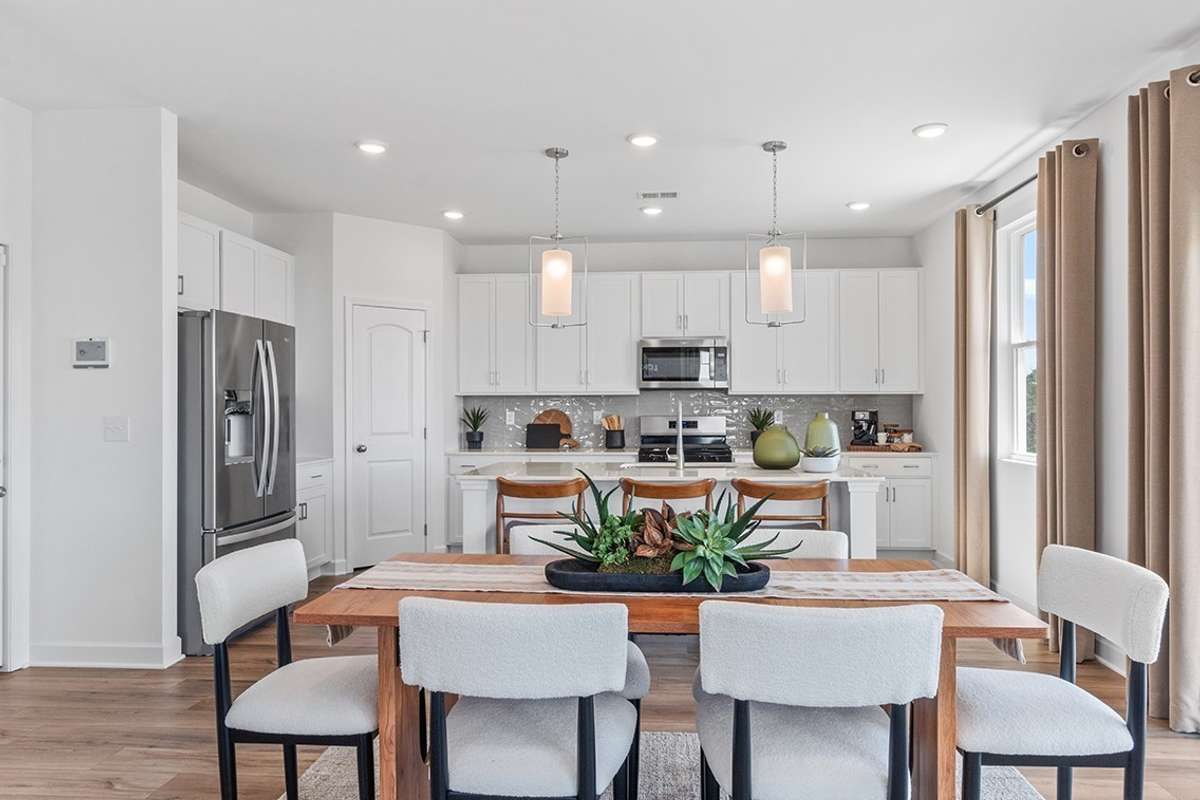 This is a photo of one of our model homes. Please know that some of the exterior and interior finishes, paint, and features may vary.
