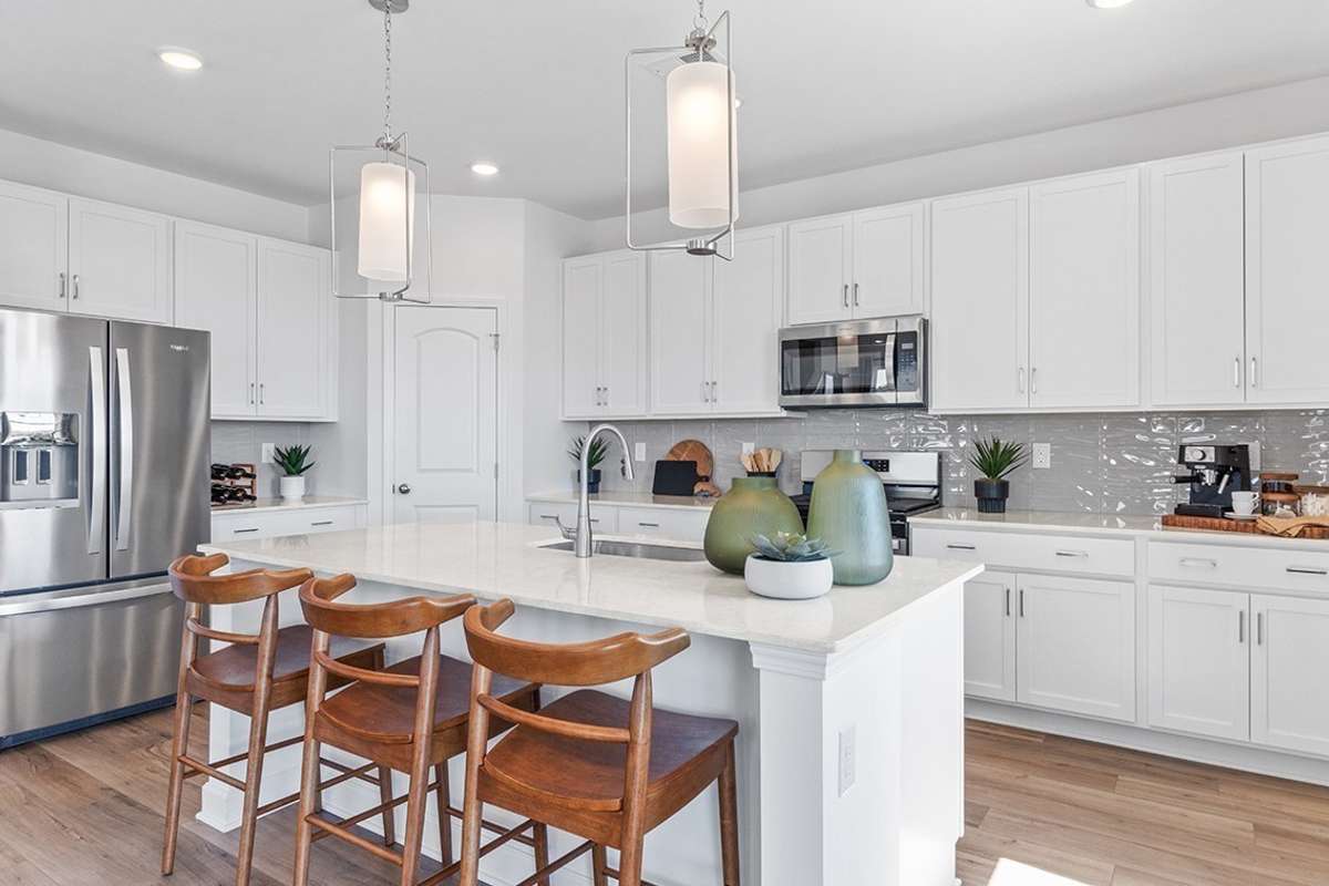 This is a photo of one of our model homes. Please know that some of the exterior and interior finishes, paint, and features may vary.