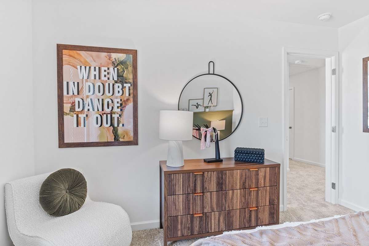 This is a photo of one of our model homes. Please know that some of the exterior and interior finishes, paint, and features may vary.