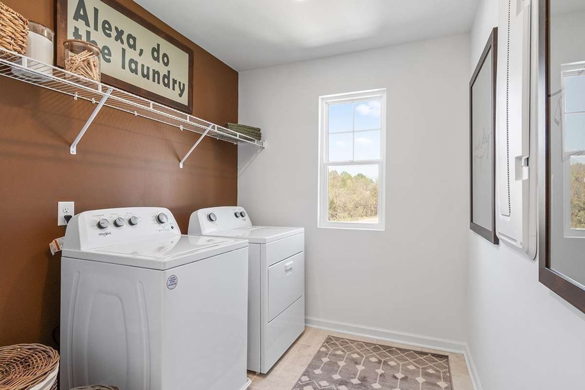 This is a photo of one of our model homes. Please know that some of the exterior and interior finishes, paint, and features may vary.