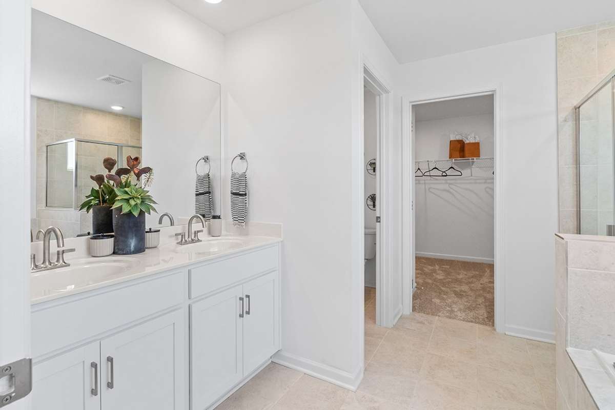 This is a photo of one of our model homes. Please know that some of the exterior and interior finishes, paint, and features may vary.
