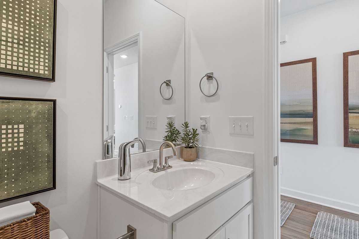 This is a photo of one of our model homes. Please know that some of the exterior and interior finishes, paint, and features may vary.