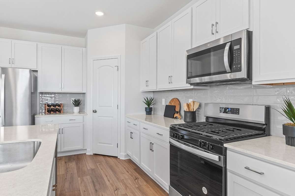 This is a photo of one of our model homes. Please know that some of the exterior and interior finishes, paint, and features may vary.