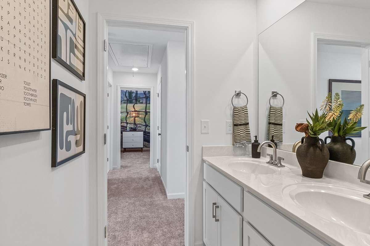 This is a photo of one of our model homes. Please know that some of the exterior and interior finishes, paint, and features may vary.