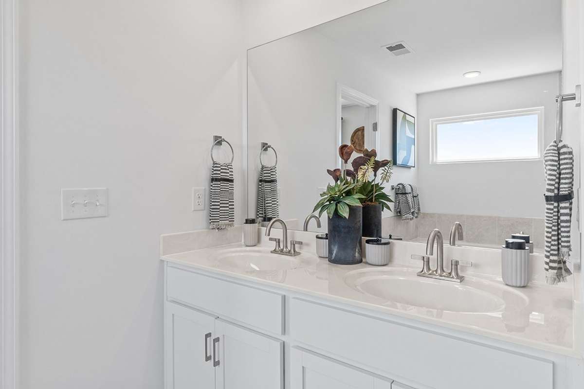 This is a photo of one of our model homes. Please know that some of the exterior and interior finishes, paint, and features may vary.