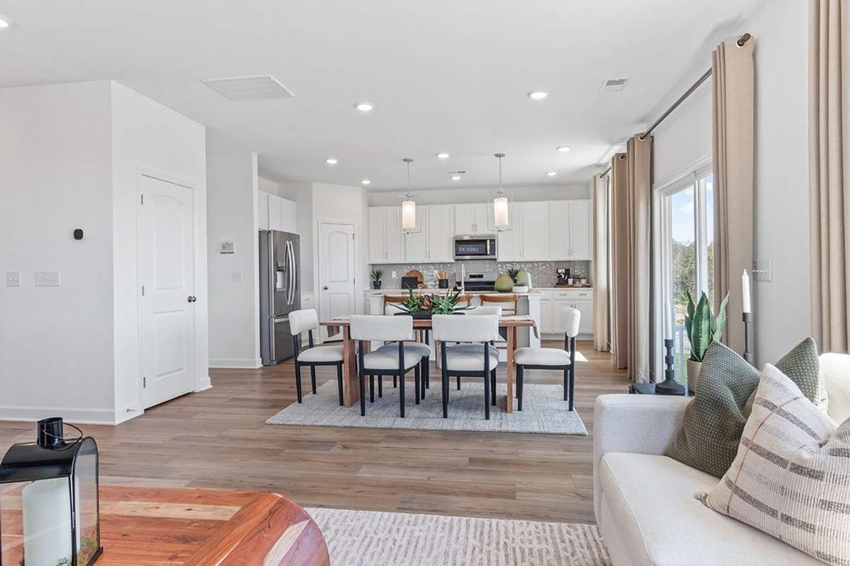 This is a photo of one of our model homes. Please know that some of the exterior and interior finishes, paint, and features may vary.
