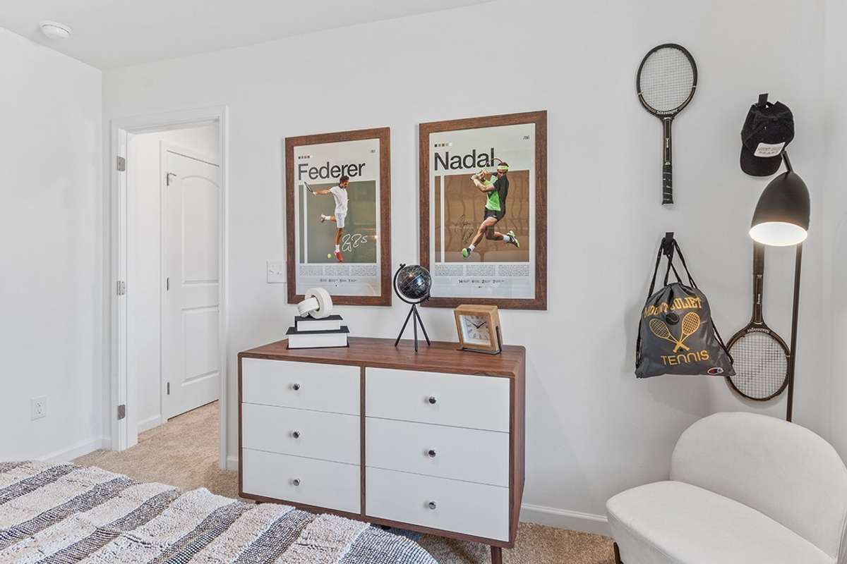 This is a photo of one of our model homes. Please know that some of the exterior and interior finishes, paint, and features may vary.