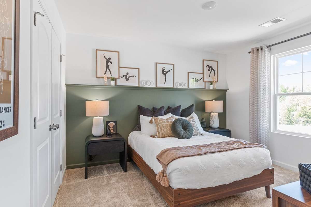 This is a photo of one of our model homes. Please know that some of the exterior and interior finishes, paint, and features may vary.