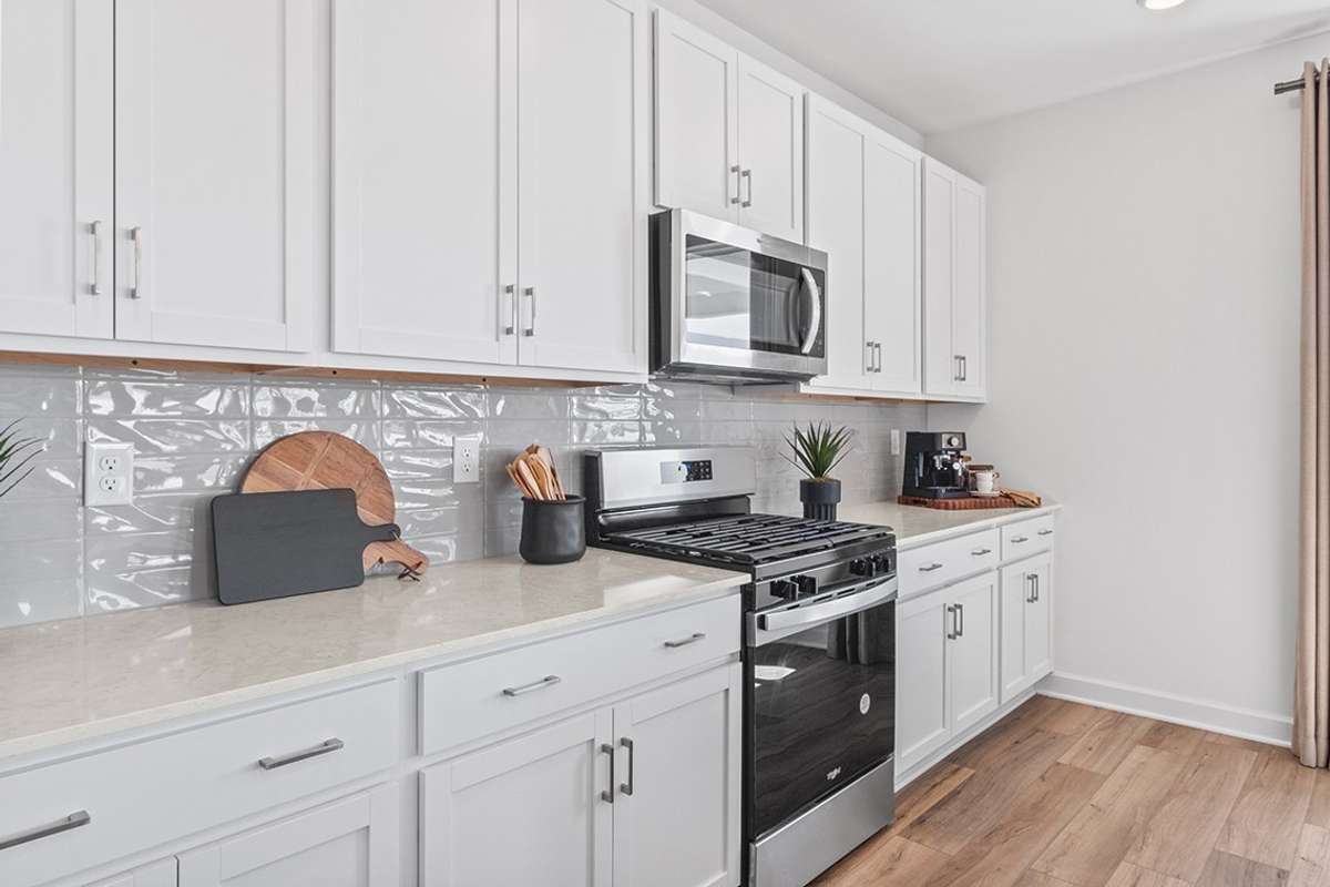 This is a photo of one of our model homes. Please know that some of the exterior and interior finishes, paint, and features may vary.