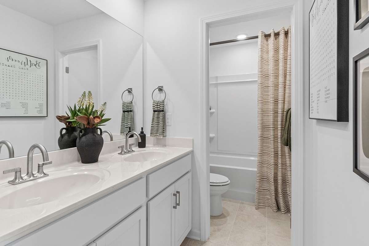 This is a photo of one of our model homes. Please know that some of the exterior and interior finishes, paint, and features may vary.