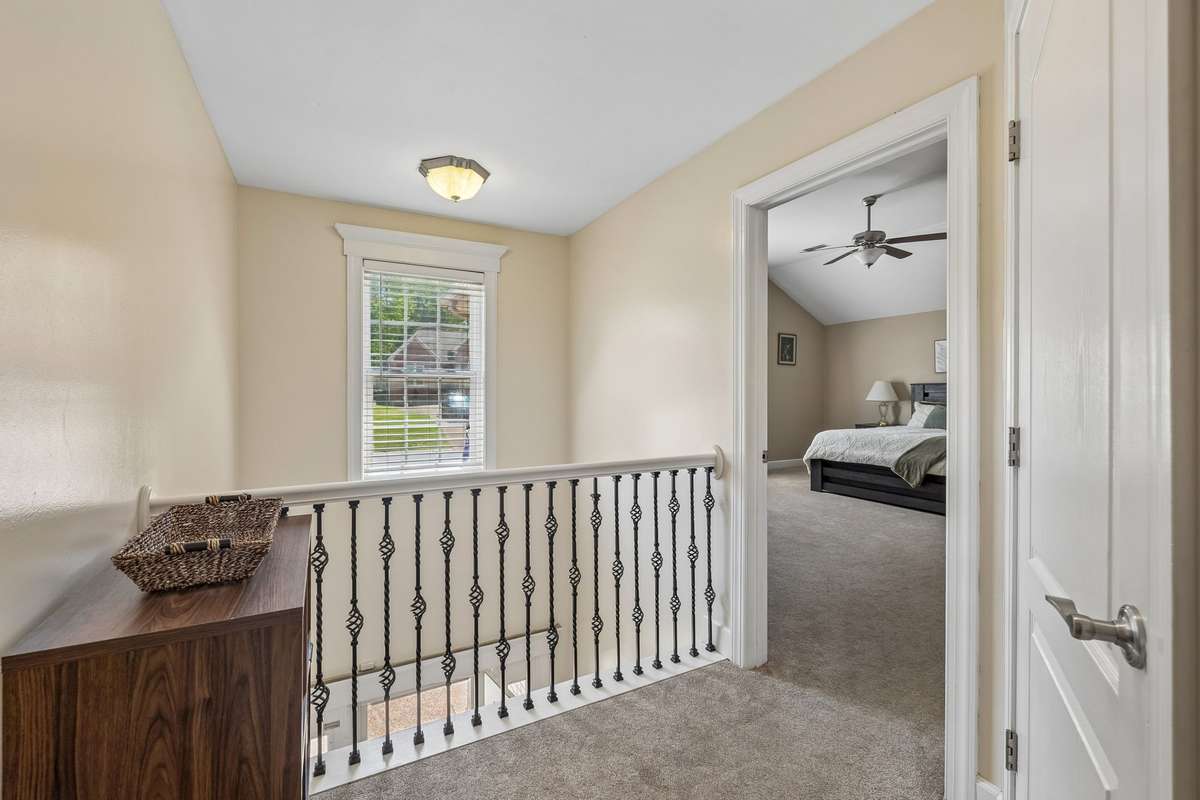 Upstairs landing area overlooks entry.
