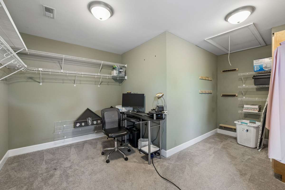 Massive walk in primary closet has built in safe and is large enough to double as a nursery off the main bedroom.