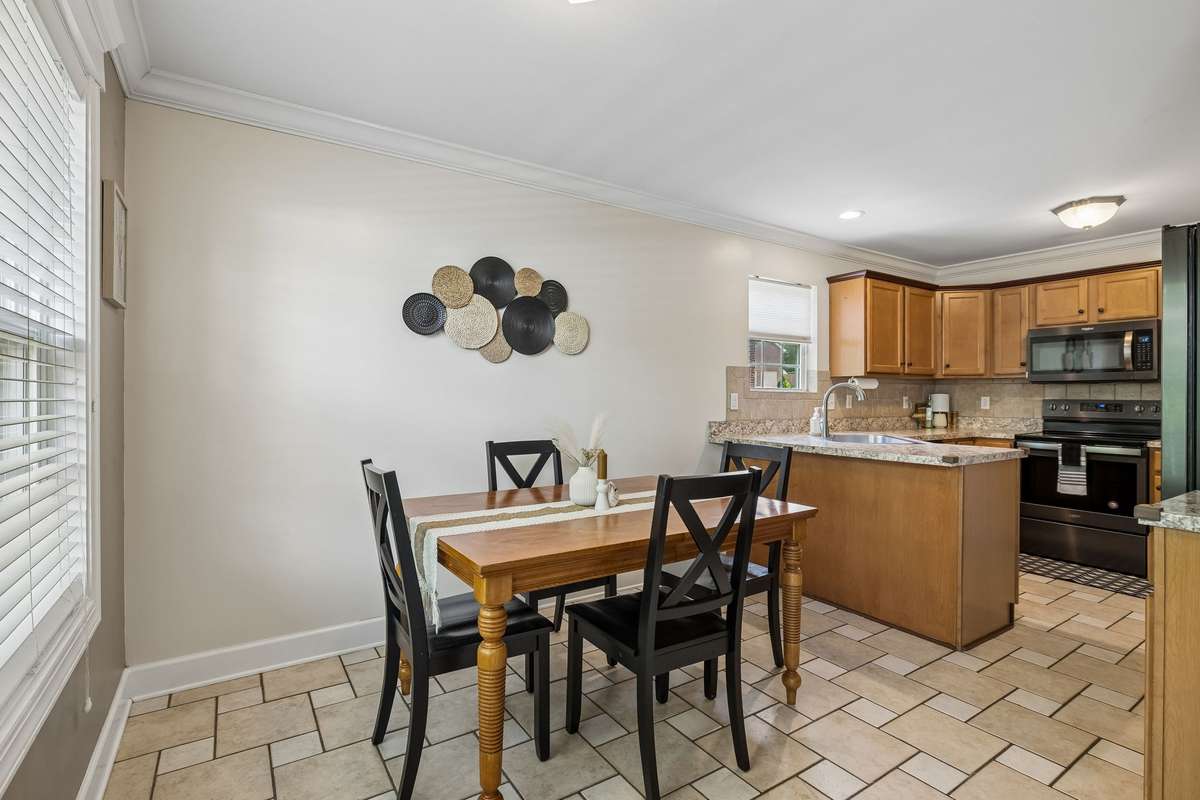 Eat in area overlooks backyard.