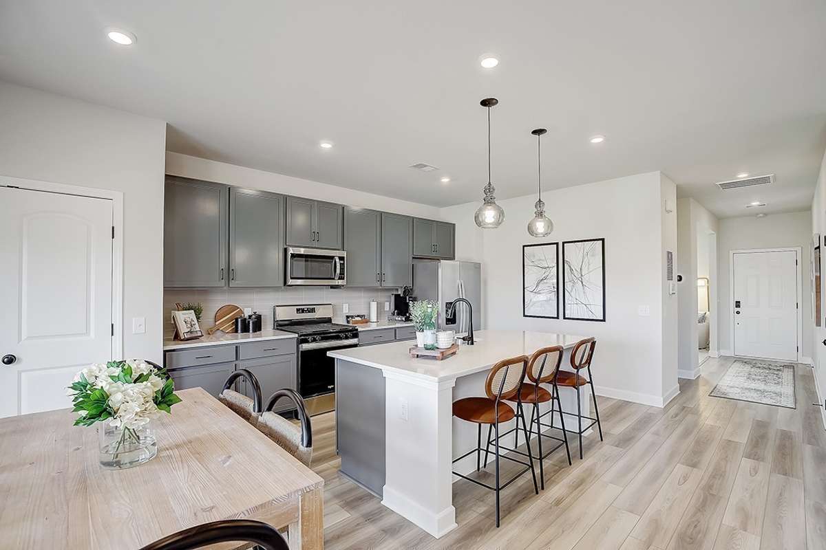 This is a photo of one of our model homes. Please know that some of the exterior and interior finishes, paint, and features may vary.