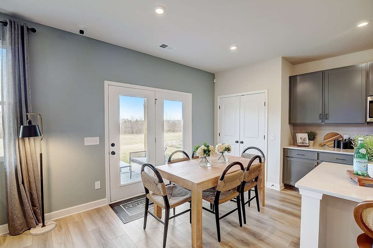 This is a photo of one of our model homes. Please know that some of the exterior and interior finishes, paint, and features may vary.