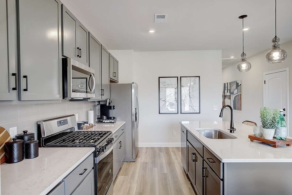 This is a photo of one of our model homes. Please know that some of the exterior and interior finishes, paint, and features may vary.