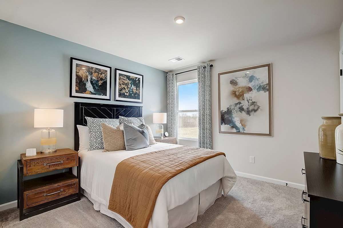 This is a photo of one of our model homes. Please know that some of the exterior and interior finishes, paint, and features may vary.