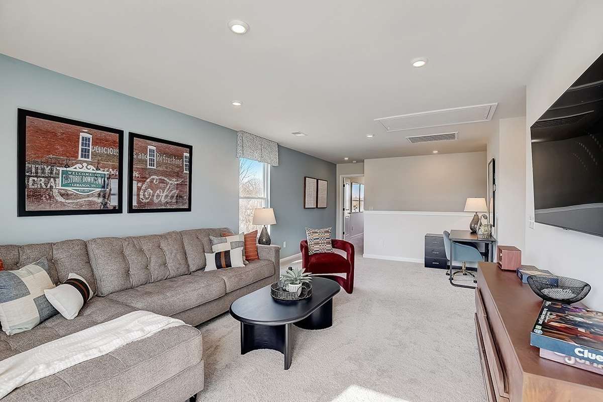 This is a photo of one of our model homes. Please know that some of the exterior and interior finishes, paint, and features may vary.