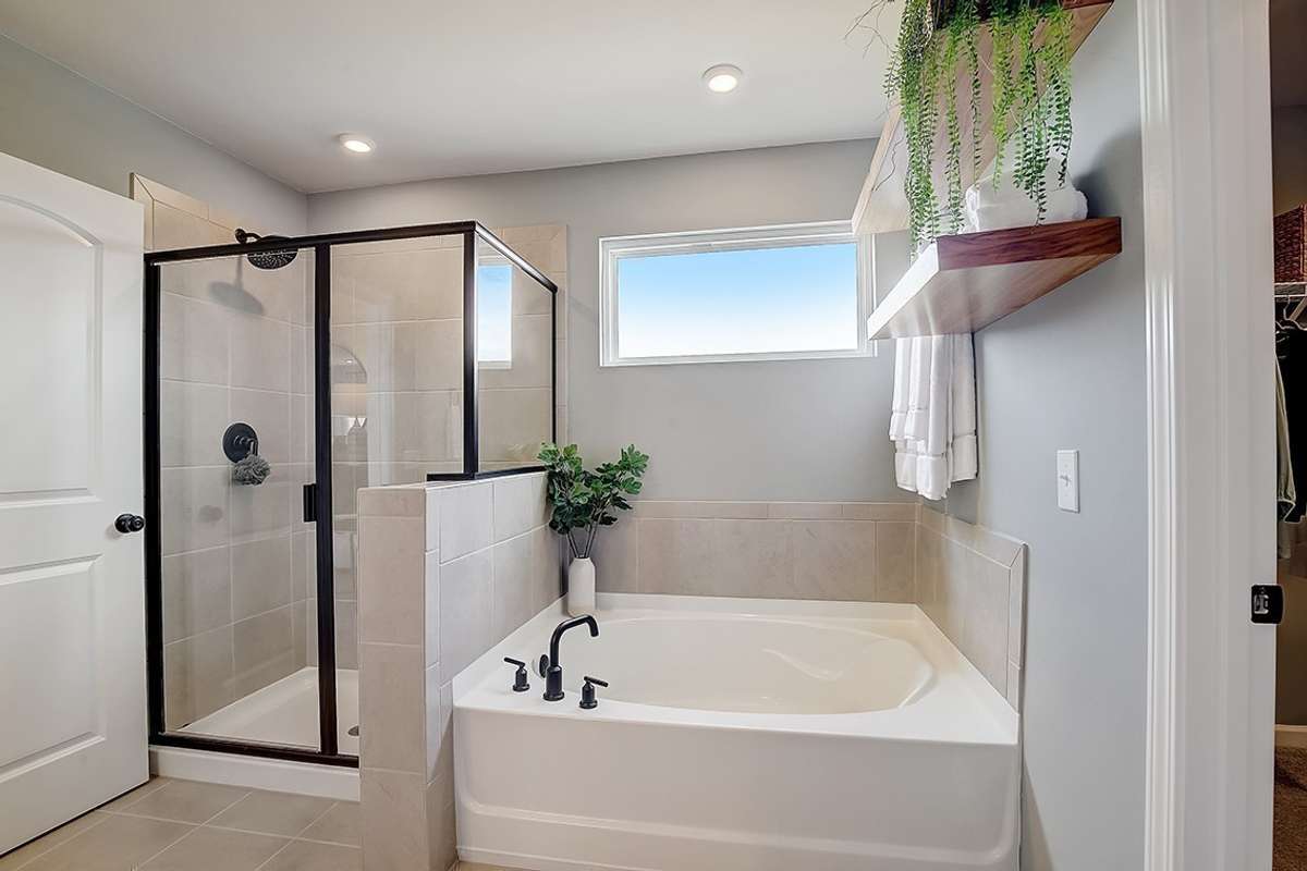 This is a photo of one of our model homes. Please know that some of the exterior and interior finishes, paint, and features may vary.