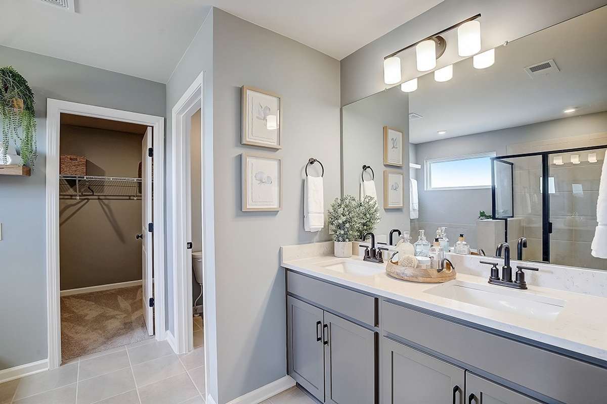 This is a photo of one of our model homes. Please know that some of the exterior and interior finishes, paint, and features may vary.