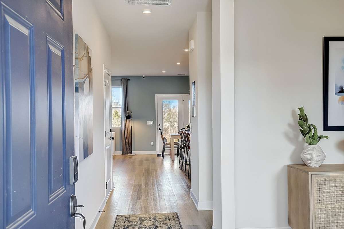 This is a photo of one of our model homes. Please know that some of the exterior and interior finishes, paint, and features may vary.