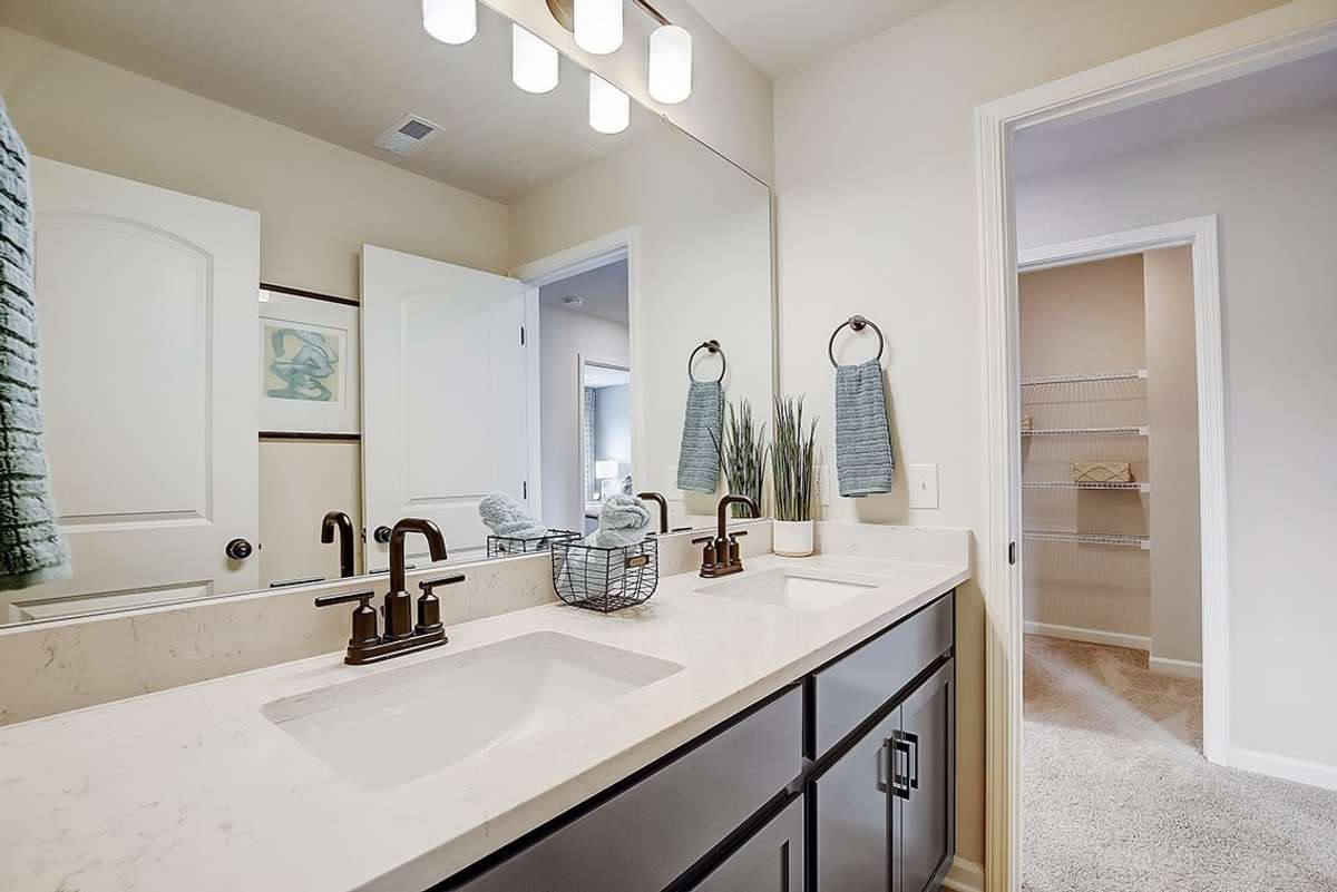 This is a photo of one of our model homes. Please know that some of the exterior and interior finishes, paint, and features may vary.