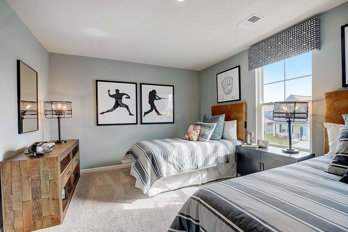 This is a photo of one of our model homes. Please know that some of the exterior and interior finishes, paint, and features may vary.