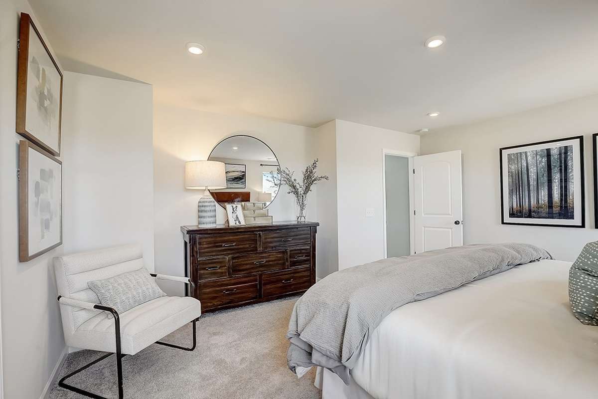 This is a photo of one of our model homes. Please know that some of the exterior and interior finishes, paint, and features may vary.