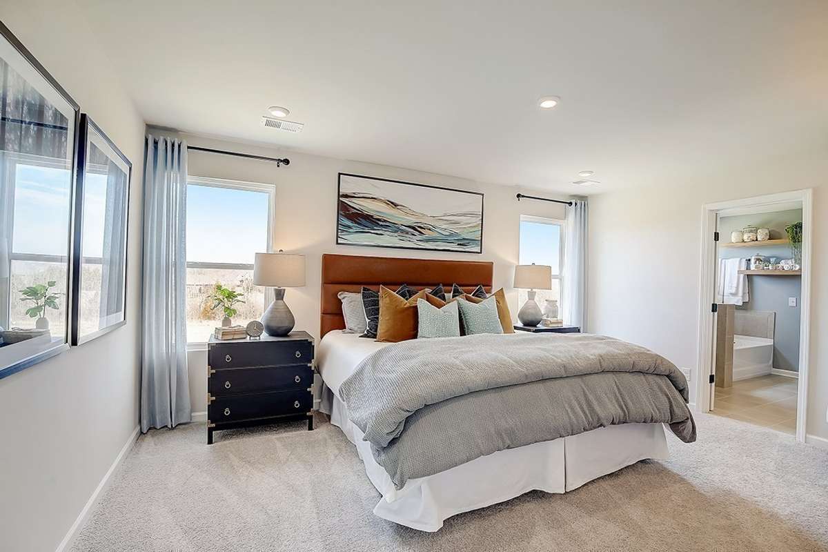 This is a photo of one of our model homes. Please know that some of the exterior and interior finishes, paint, and features may vary.
