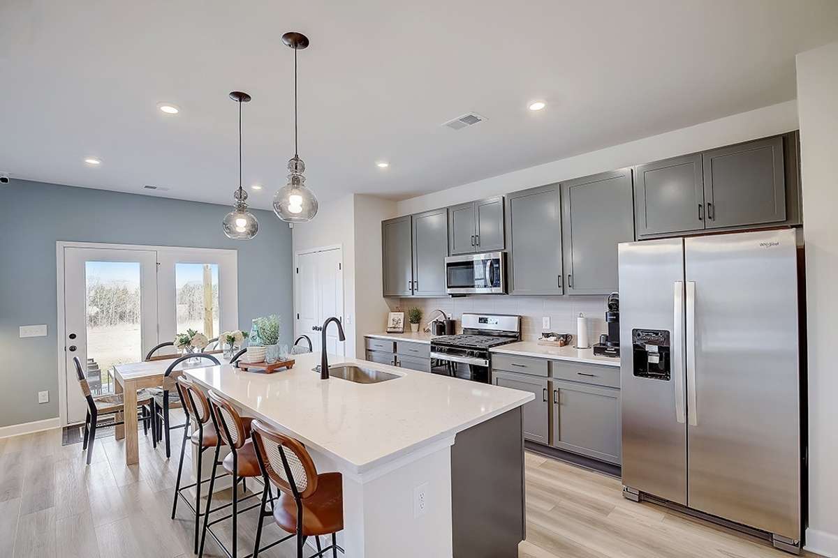 This is a photo of one of our model homes. Please know that some of the exterior and interior finishes, paint, and features may vary.