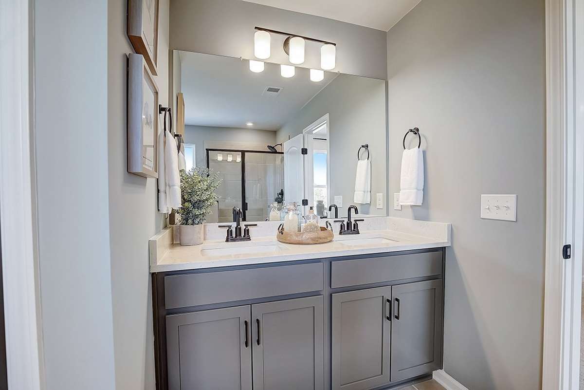 This is a photo of one of our model homes. Please know that some of the exterior and interior finishes, paint, and features may vary.