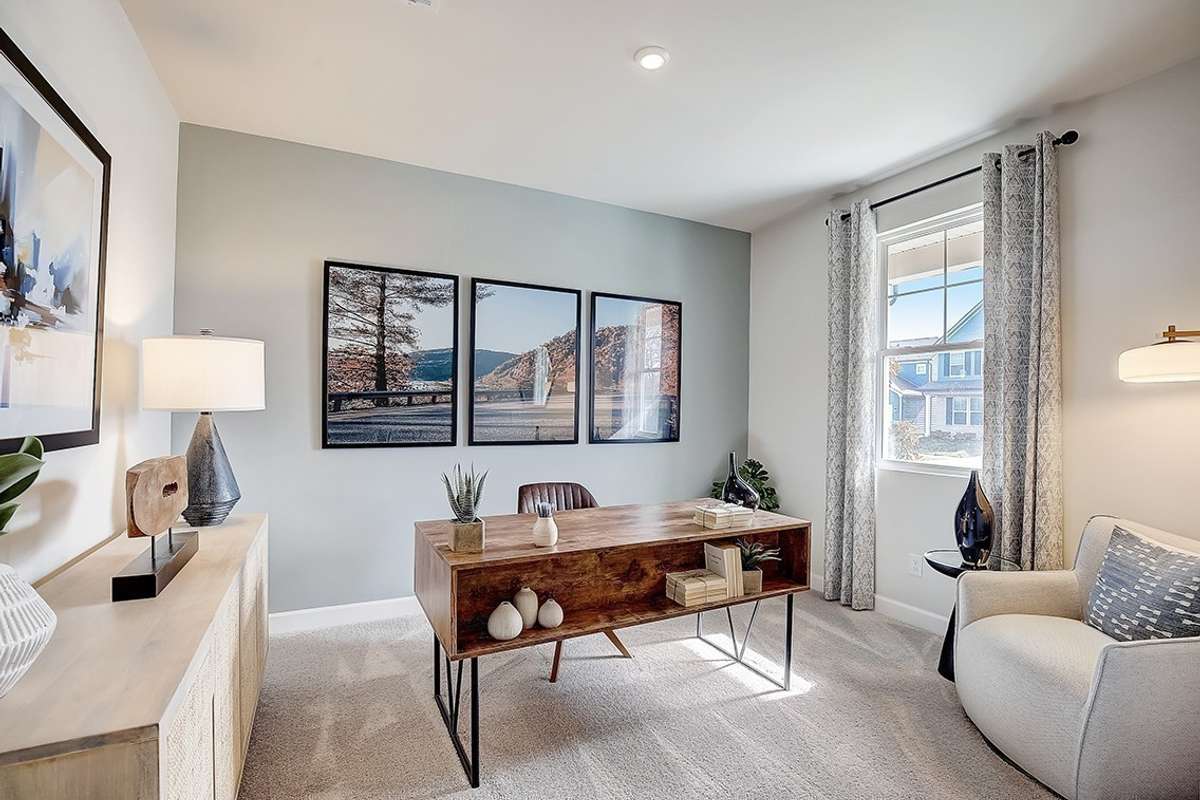 This is a photo of one of our model homes. Please know that some of the exterior and interior finishes, paint, and features may vary.