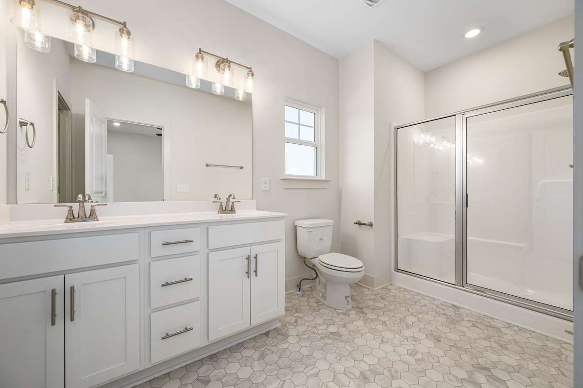 Primary bathroom of similar plan