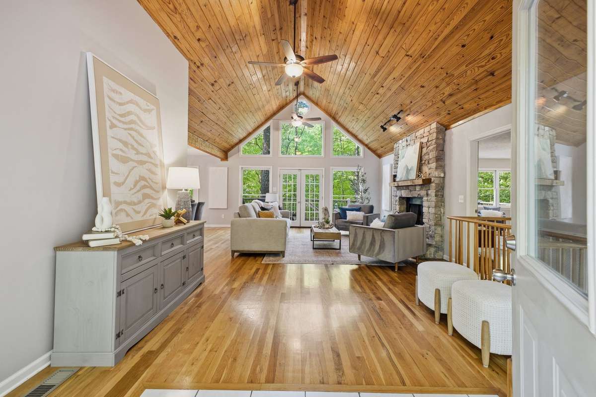 Upon entry, you will be dazzled by knotty pine ceilings and shiny hardwood floors!  Oh, and that view!!