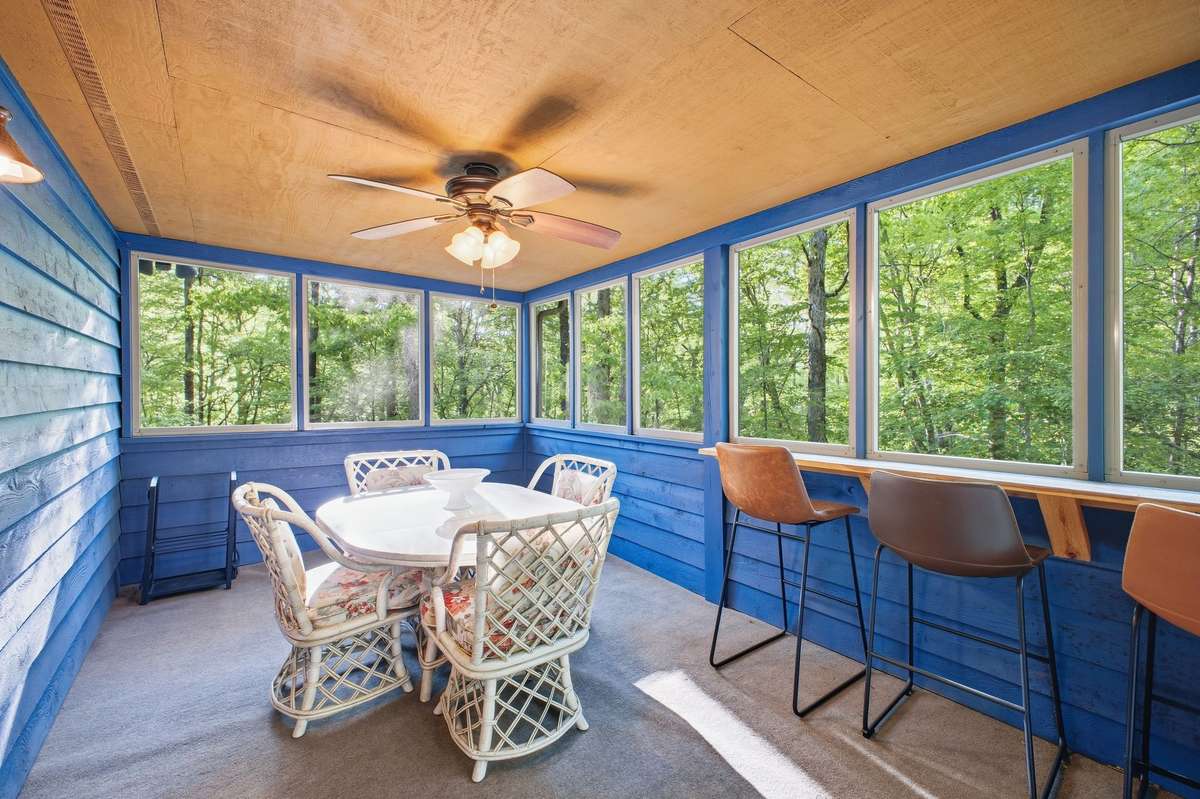 Screened in sunporch for dining or resting.