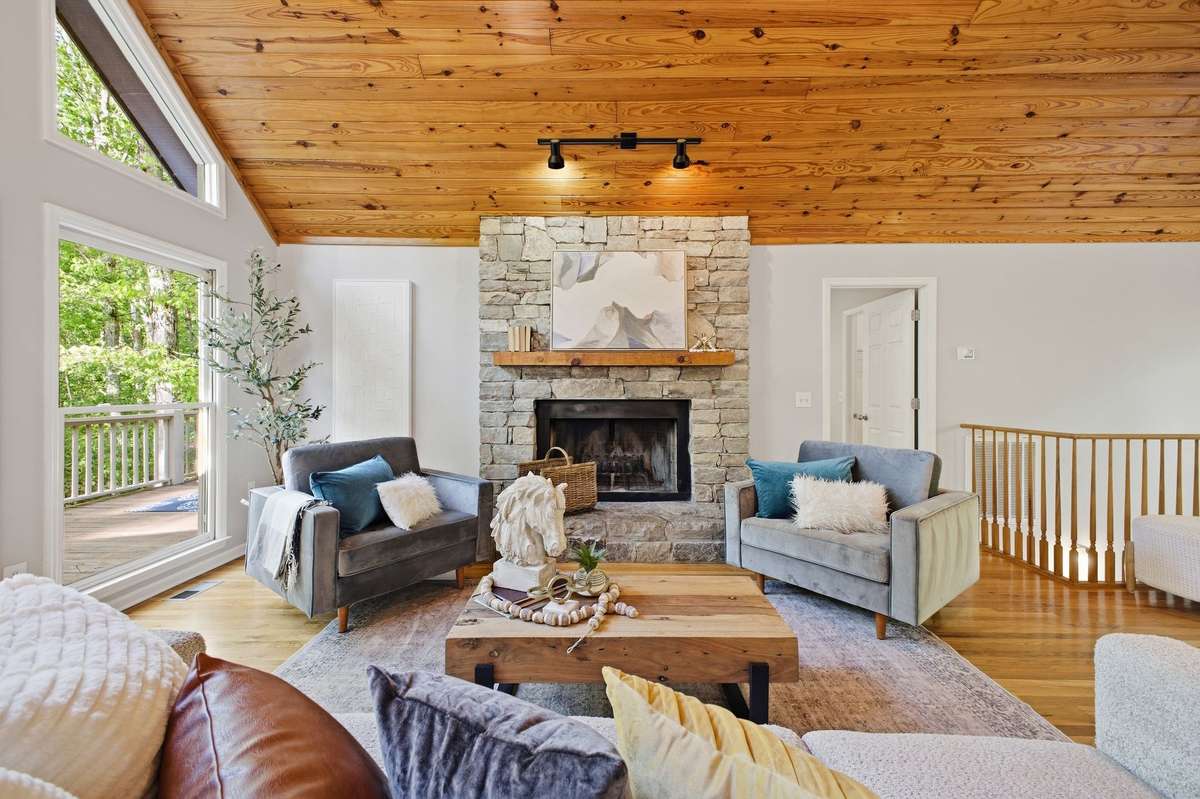 Stone fireplace is wood burning, but has already been plumbed for gas hookups