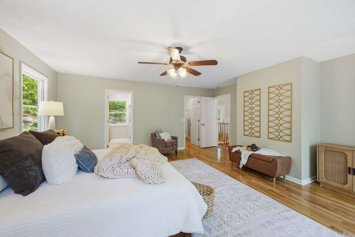 Primary Bedroom with French doors that open to the back deck.