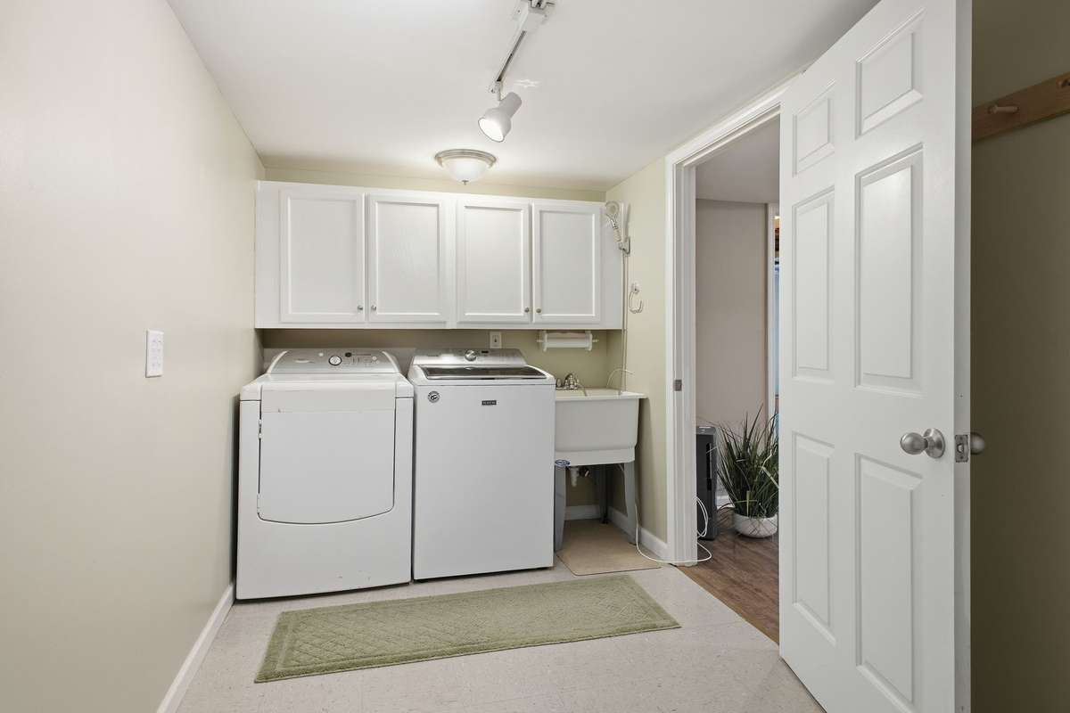 Downstairs utility room with wash basin.
