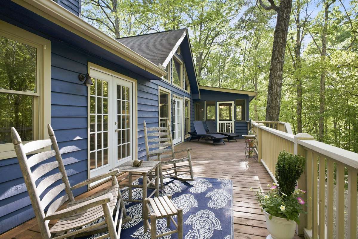 The expansive back porch is for nature lovers!  It receives sun almost all day so you can grow your patio tomatoes and herbs.
