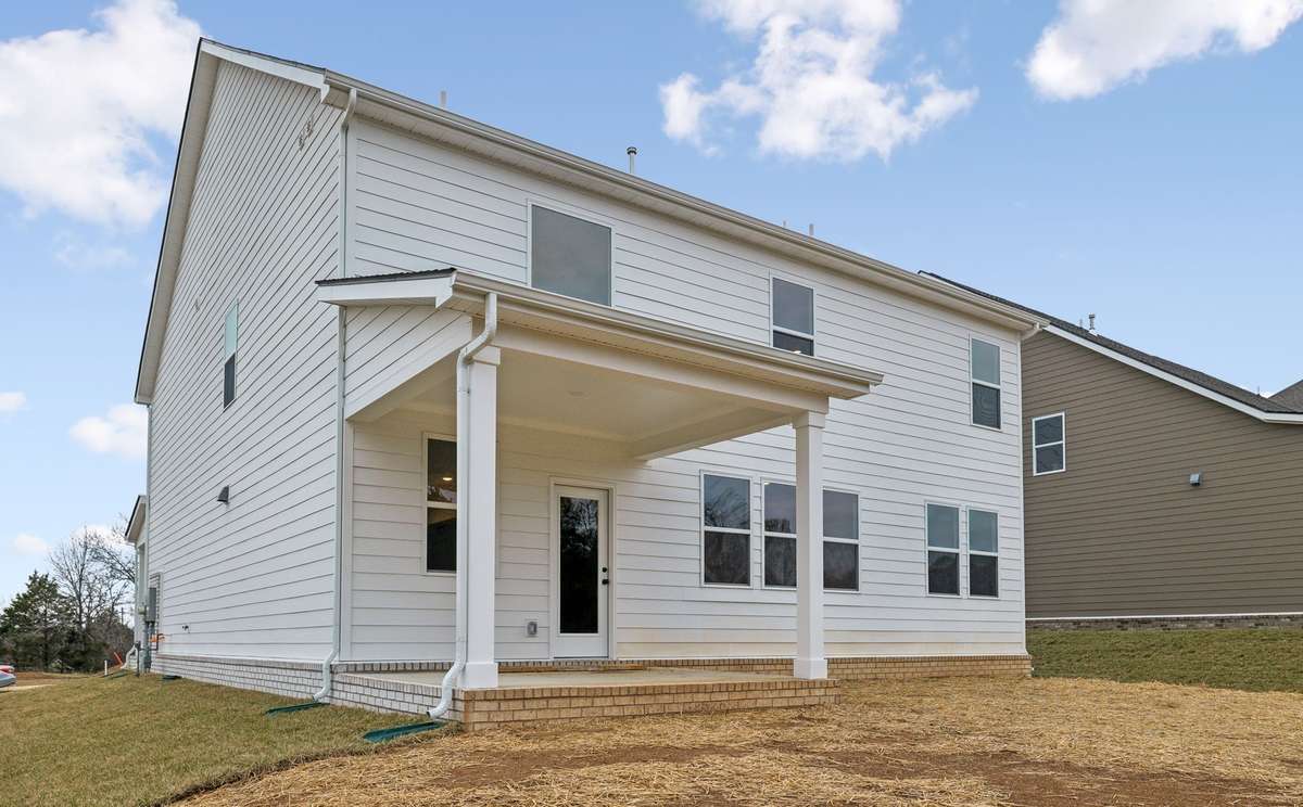 Enjoy outdoor living year-round on this spacious covered patio, perfect for relaxing, dining or entertaining. A seamless extension of the home's living space, it offers plenty of room to create your ideal outdoor retreat.
