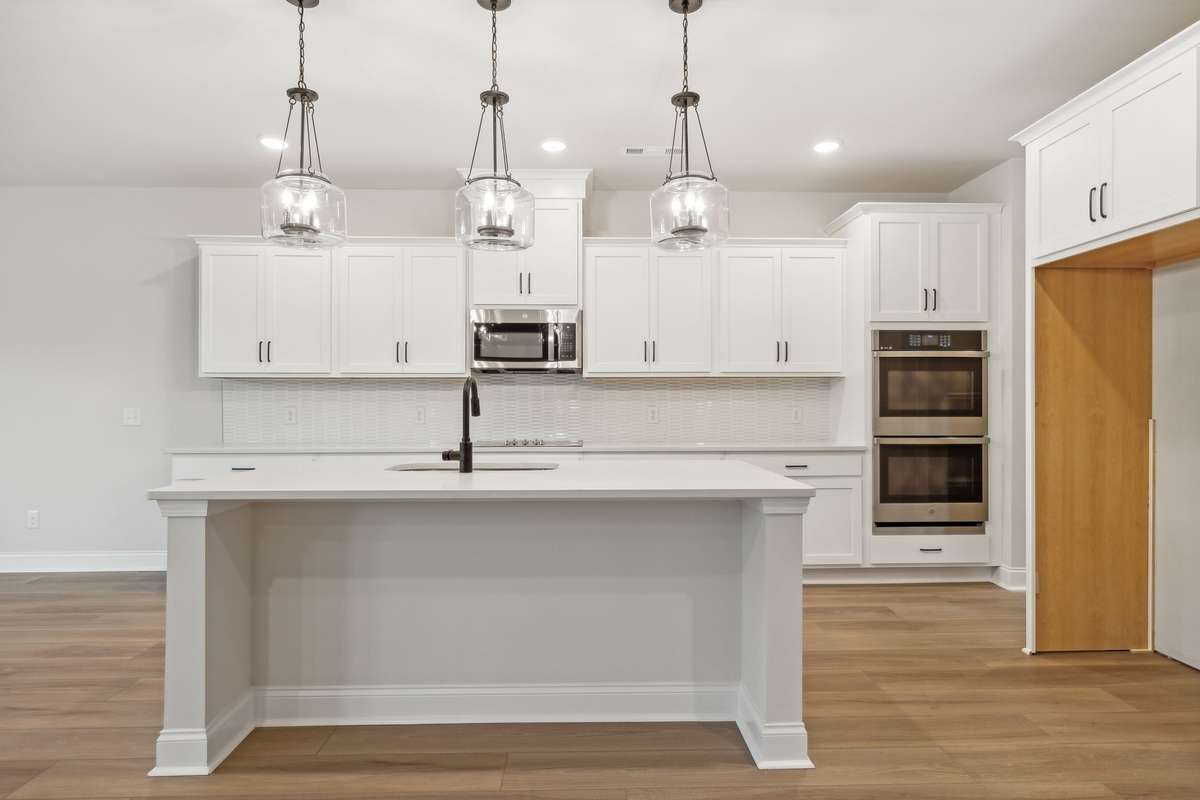 This large kitchen island offers additional seating, perfect for casual dining, morning coffee, or entertaining guests. A stylish and functional centerpiece that enhances both the beauty and practicality of the gourmet kitchen.