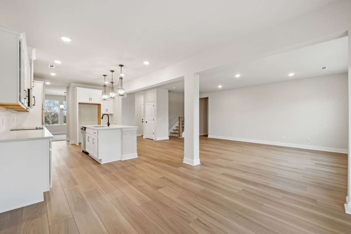 Located just off the kitchen, the breakfast space is filled with natural light and offers the perfect spot for casual meals or morning coffee. Its open layout provides a seamless flow to the kitchen and main living areas, ideal for everyday living.