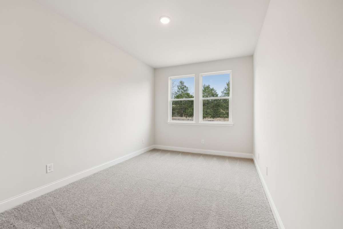 Comfortable and accessible, the 1st floor guest bedroom is ideally located near a full bathroom for added convenience.