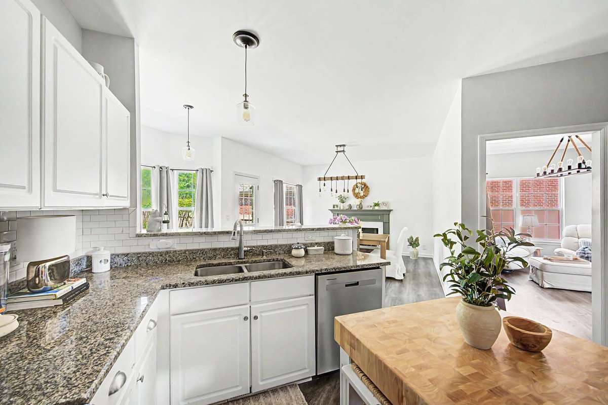 Kitchen is open to dining and more. Laundry is off the kitchen.