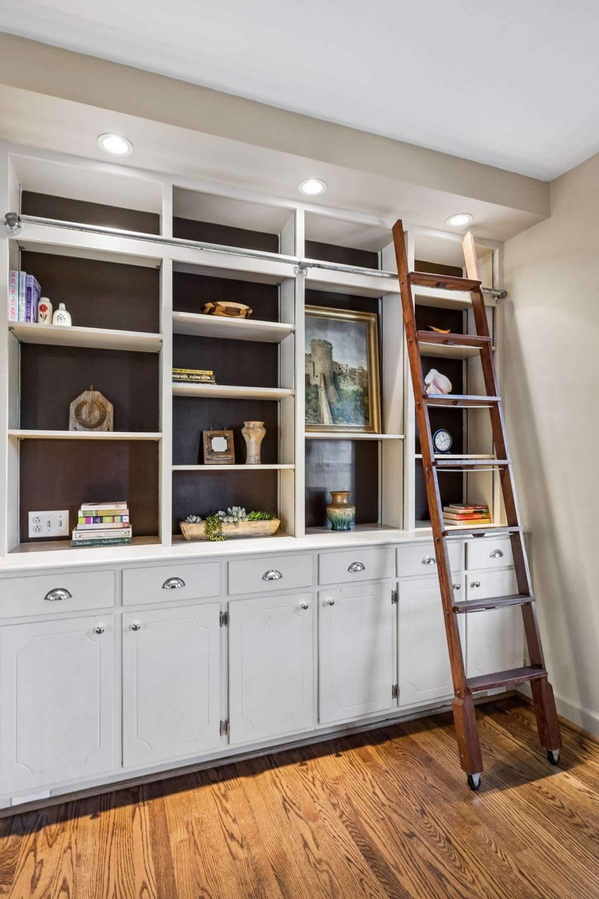 Who doesn't love and need storage and builtins!  This classic look with the library ladder is timeless.