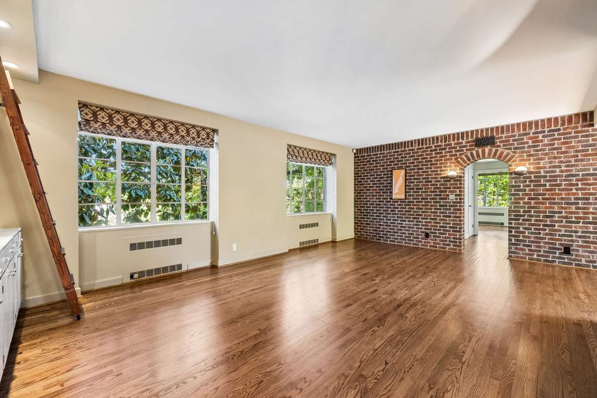 Bright, inviting space with strong bones this unit blends  warmth with architectural interest and plenty of flexibility for modern living and entertaining.