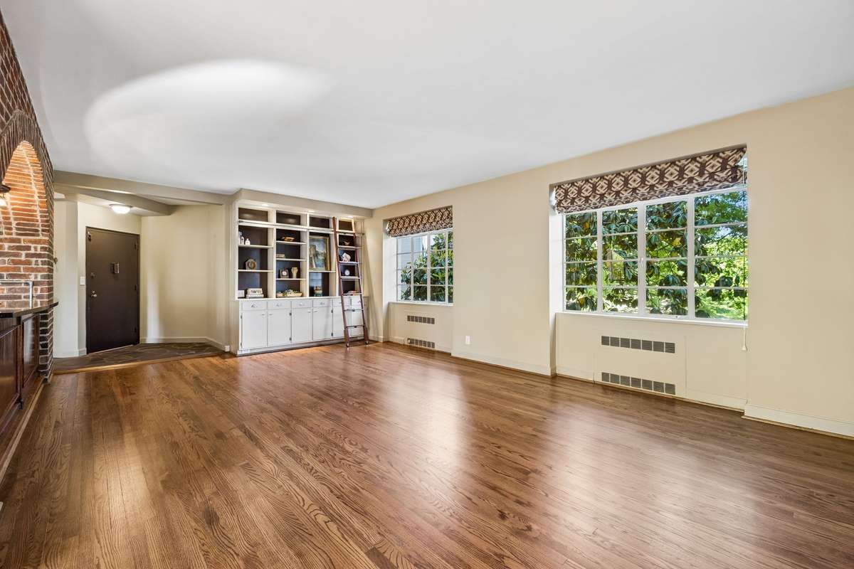 This space creates a warm, character-rich canvas with a subtle nod to early mid-century charm and architectural texture.