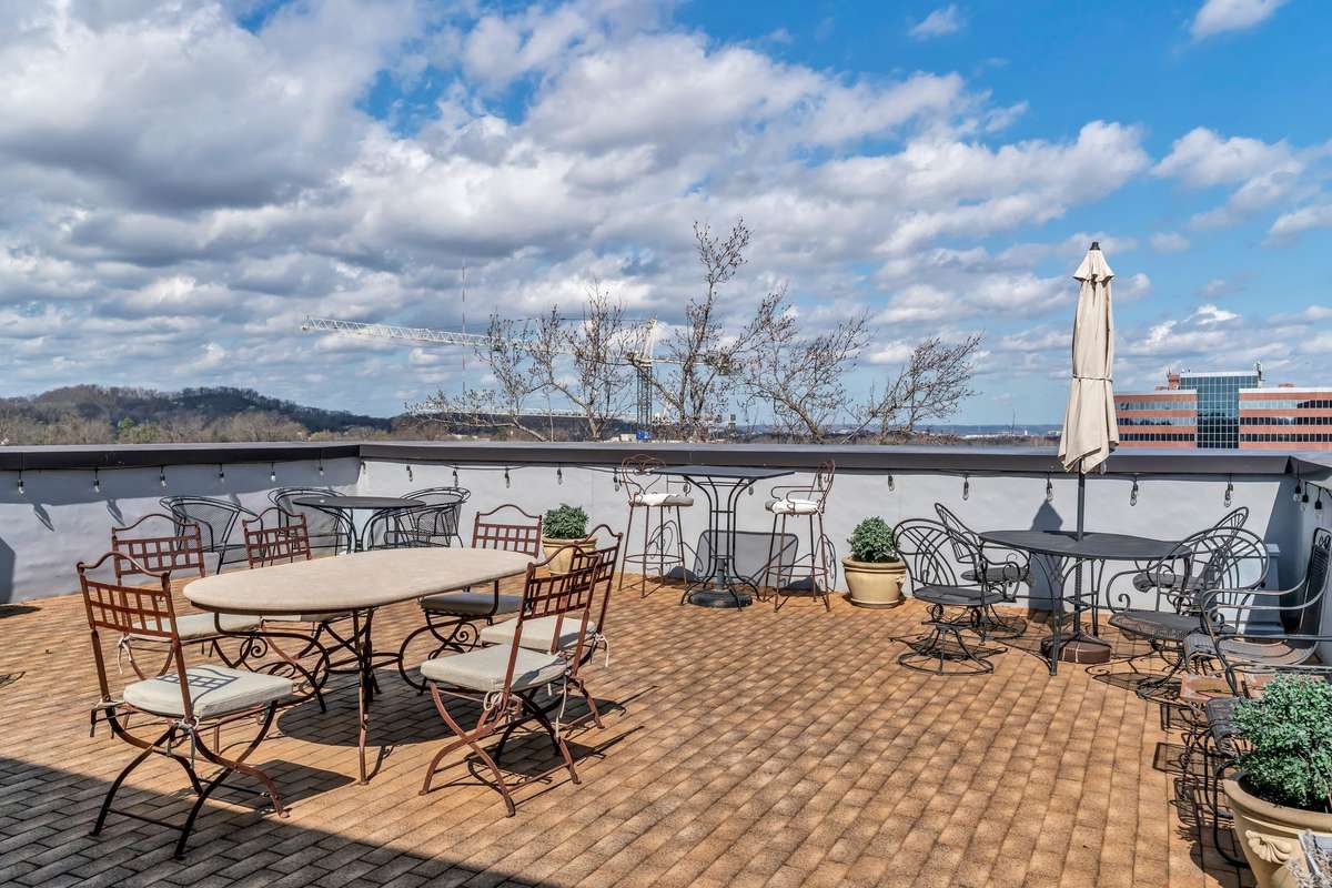 You will have a front row view of the evolution of Belle Meade Village being built across the street on the rooftop deck.